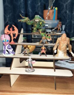 A laser-cut tiered display rack for tabletop miniatures — perfect for organizing and showing off painted figures.